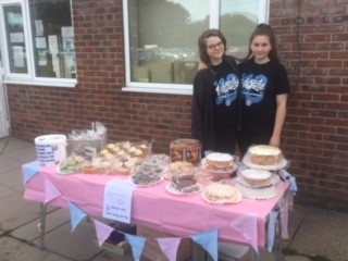 Jess and Amelia raising money for the Walkington defibrillator with a bake sale