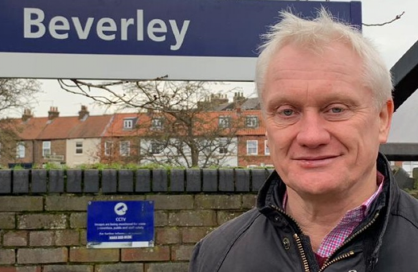 Graham headshot with Beverley sign