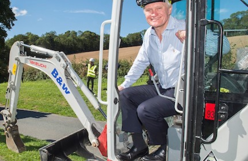 Graham sitting in an excavator