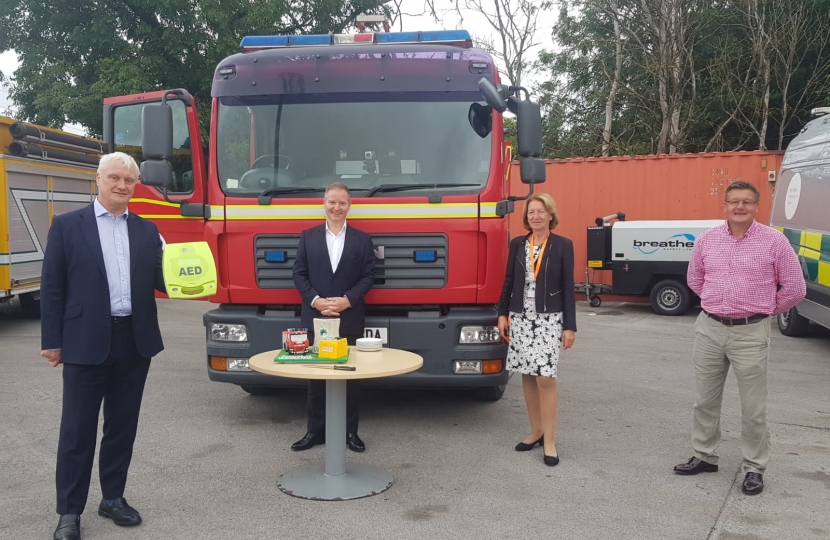 Graham with new defibrillator with (L-R) Geoff Holmes (px Group) Cllr Sue Steel Nick Granger (HFR Solutions)