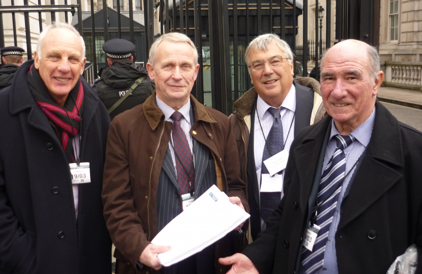 Les Diment, Cllr Mike Bryan, Cllr John Denis and Ron Smith handing Graham's Home Flood Insurance Petition into No.10