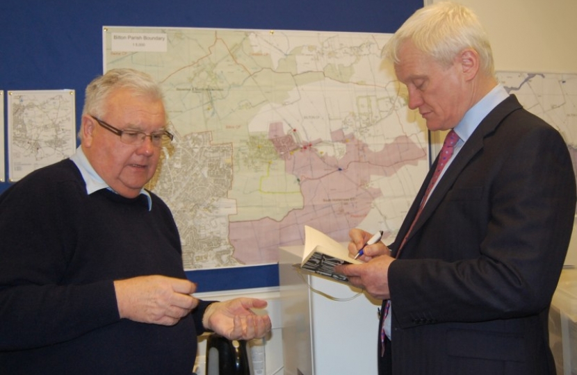 Parish Clerk, Stephen Dale, briefs Graham in front of the Emergency Plan map