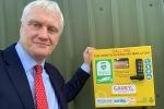 Graham standing next to an Automated External Defibrillator