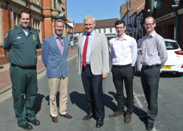 (L-R) Warren Bostock (Yorkshire Ambulance Service), Paul Downey, Graham Stuart MP, Jordan Moor and Nick Middleton (SMILE Foundation)