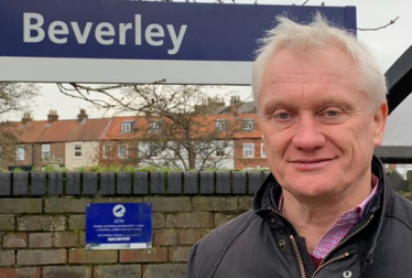 Graham headshot with Beverley sign